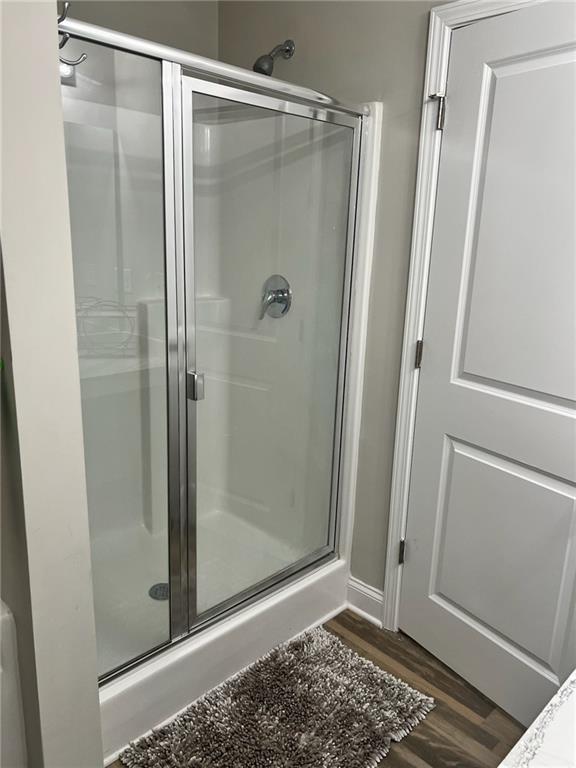 7150 Fringe Flower Drive, Unit 20 Austell, GA 30168 - Photo 10 of 41 a bathroom with a glass shower door