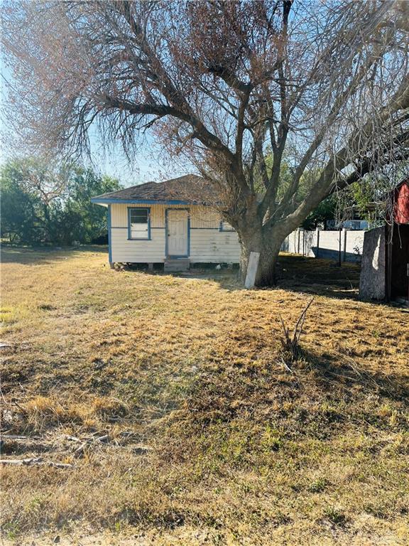 12617 North 57th Street Mission, TX 78573 - Photo 1 of 5 a front view of house with yard covered with trees