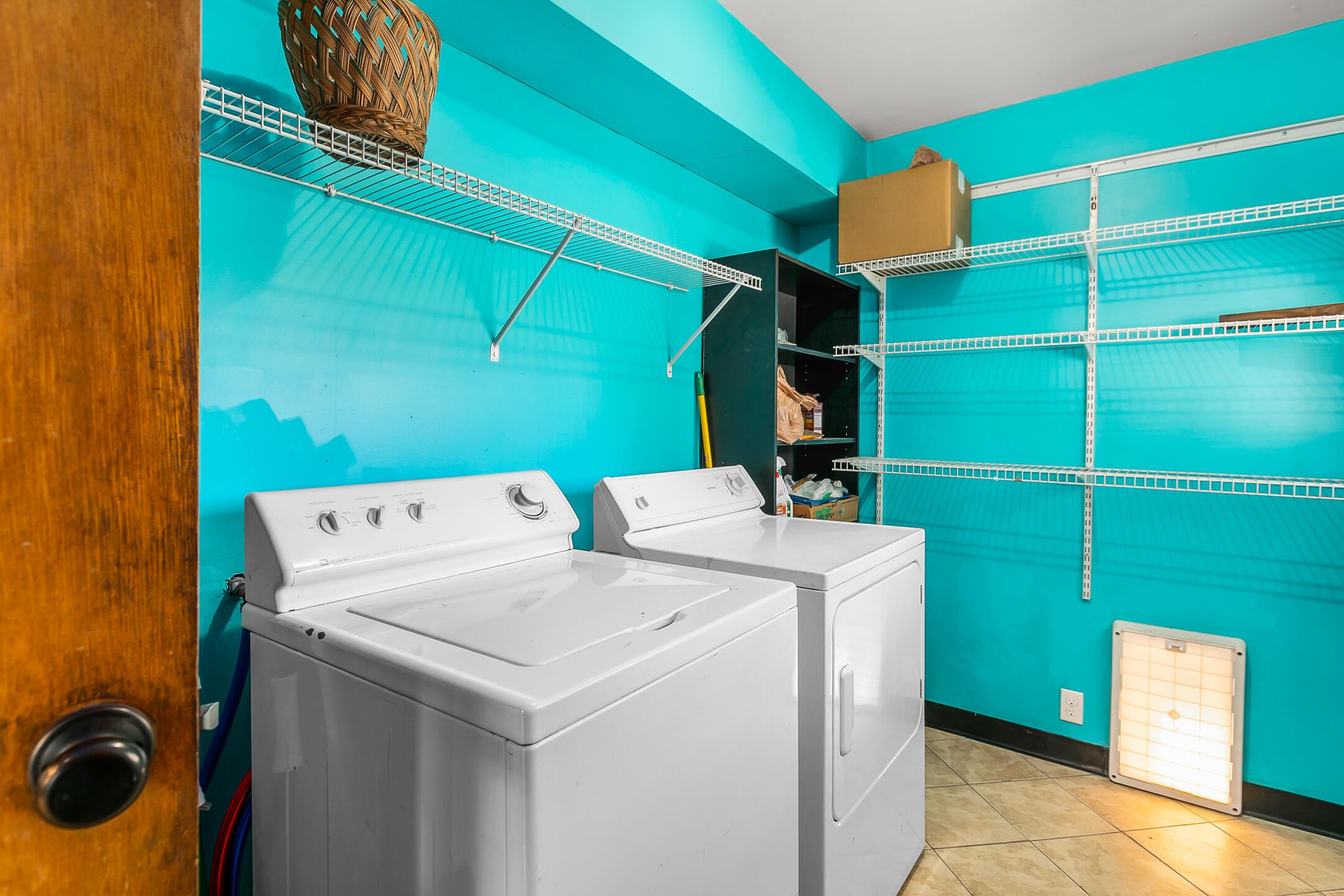 205 Southwest 9th Street Redmond, OR 97756 - Photo 19 of 24 Laundry/mud room off the kitchen with access to the carport