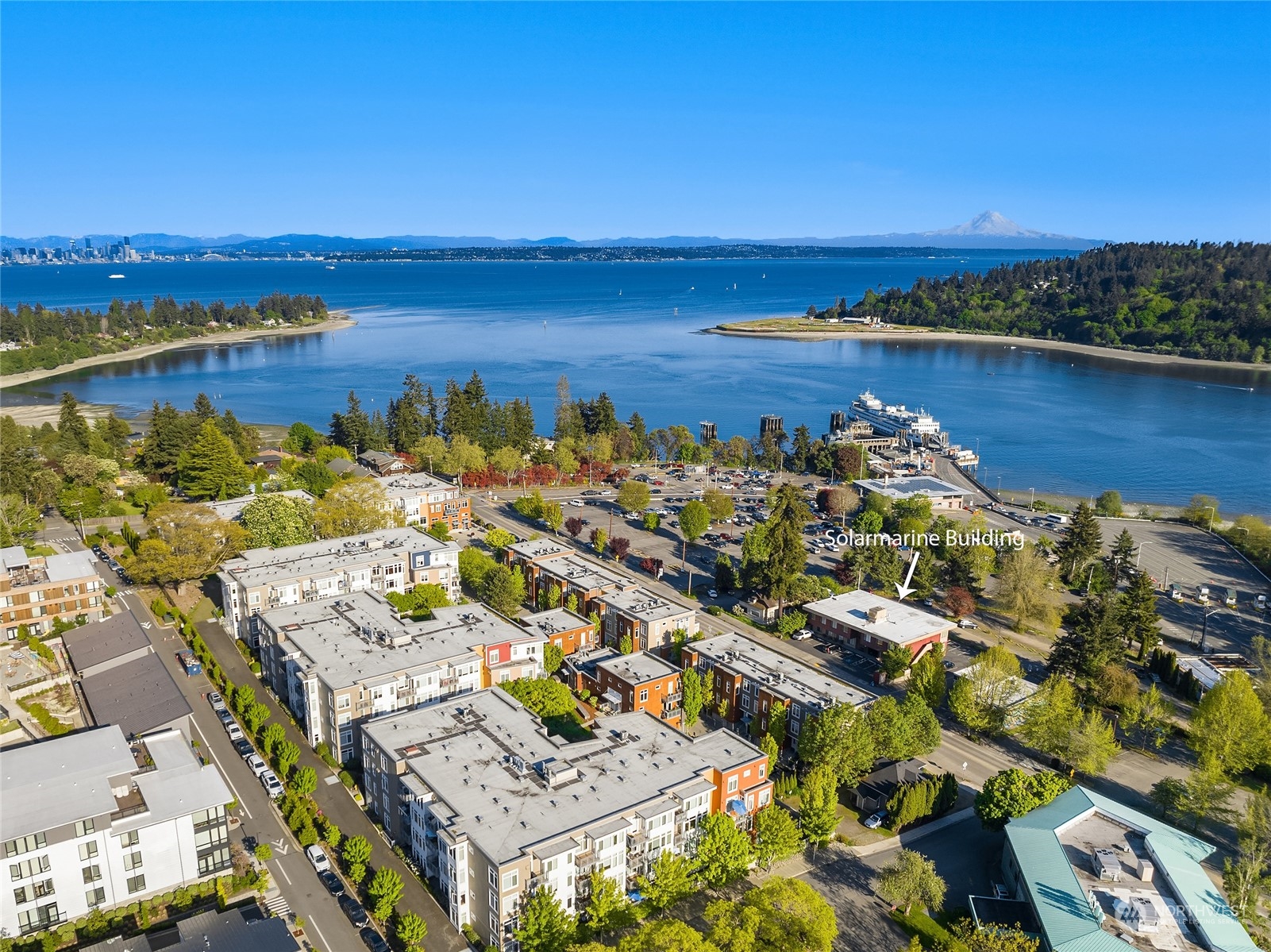 755 Winslow Way East, Unit 308 Bainbridge Island, WA 98110 - Photo 1 of 8 a view of a city with an ocean view