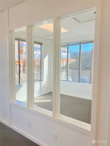 a bathroom with a glass shower door