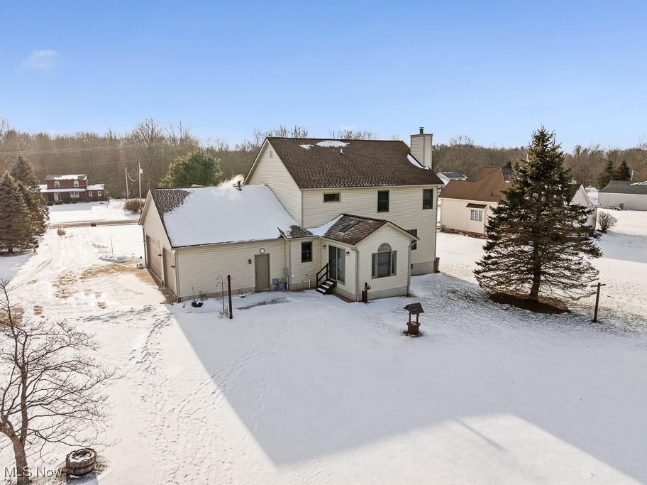 4808 Sherman Road Kent, OH 44240 - Photo 46 of 50 Snow covered rear of property with a chimney