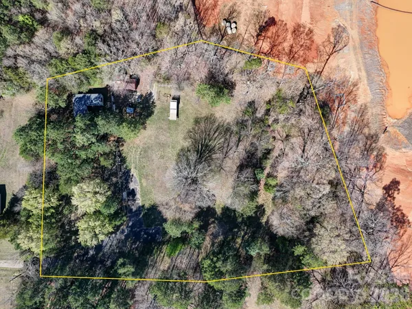 an aerial view of residential house with outdoor space