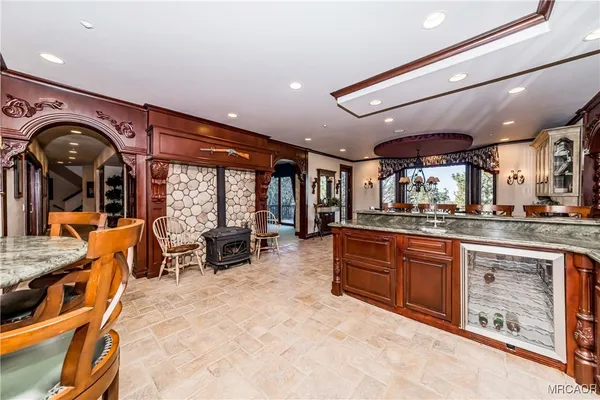 a large kitchen with stainless steel appliances granite countertop a large stove a sink and dishwasher