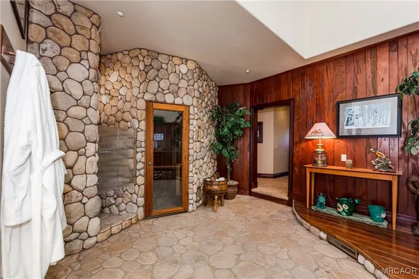 a view of an entryway with wooden floor