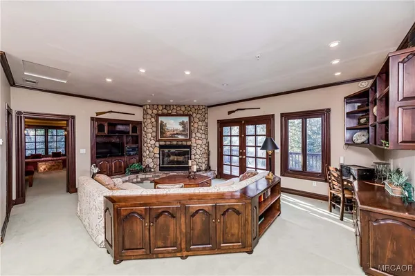 a open kitchen with stainless steel appliances granite countertop a stove and a refrigerator
