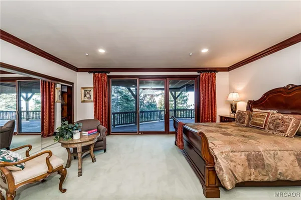 a large room with lots of furniture and a large window