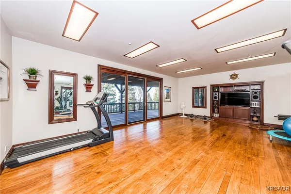 a view of porch with wooden floor