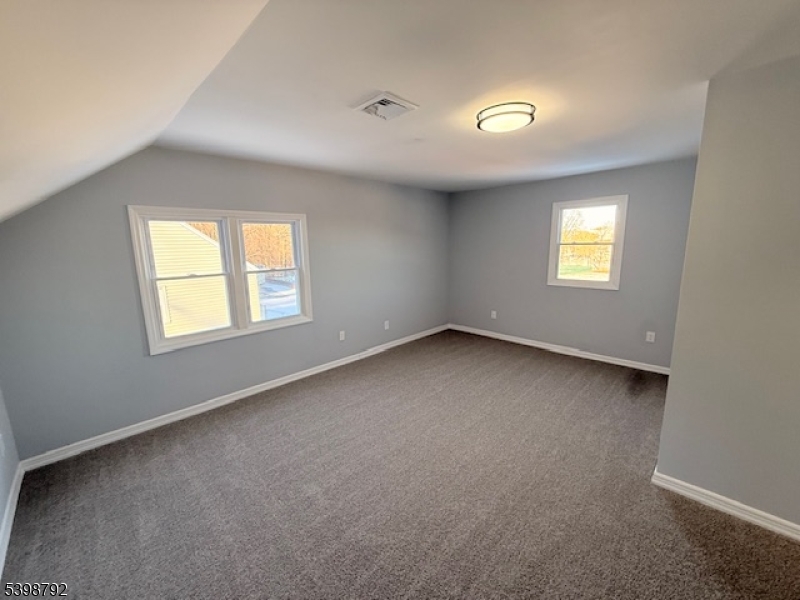 83 Academy Street Dover, NJ 07801 - Photo 13 of 14 an empty room with a window