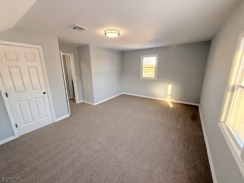 83 Academy Street Dover, NJ 07801 - Photo 14 of 14 an empty room with windows