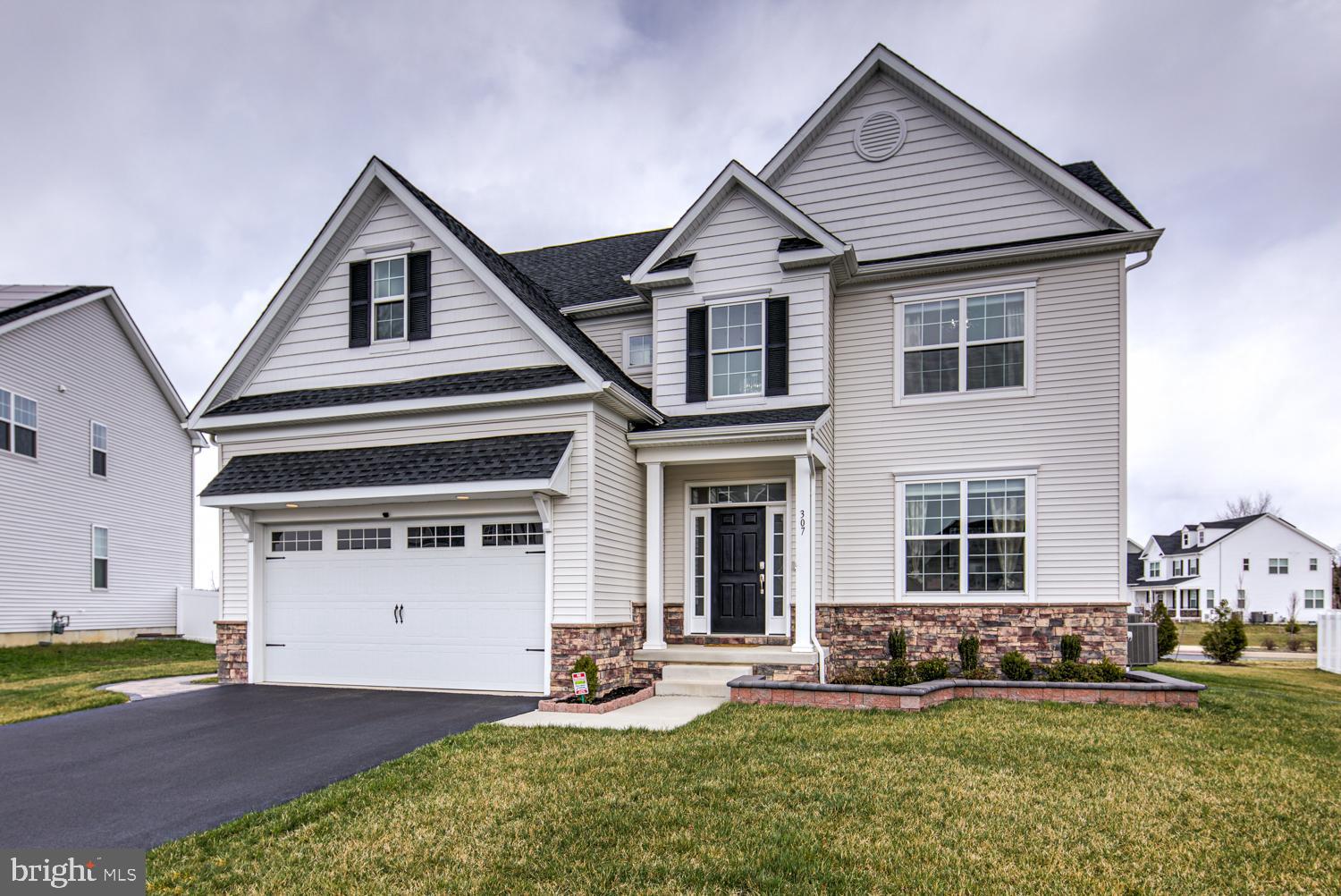 307 Appleford Circle Bear, DE 19701 - Photo 1 of 1 a front view of a house with a yard and garage