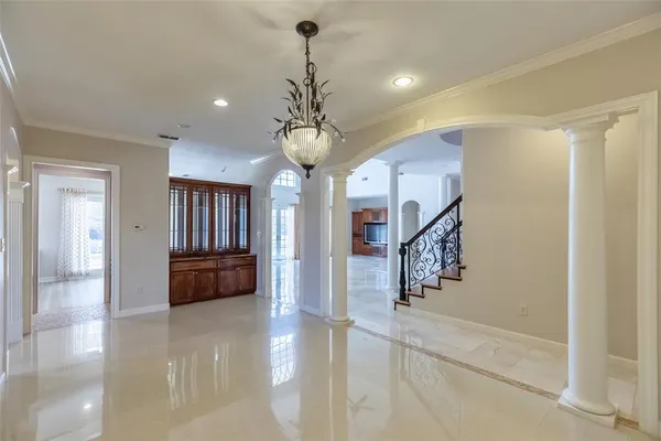 a view of entryway and hall with a front door