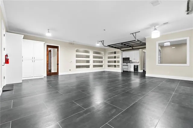 a view of a livingroom with wooden floor and white walls
