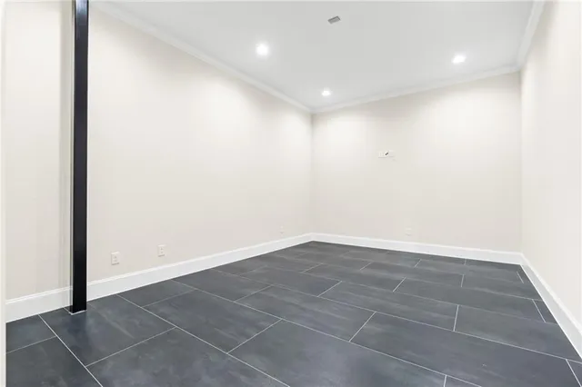 an empty room with wooden floor