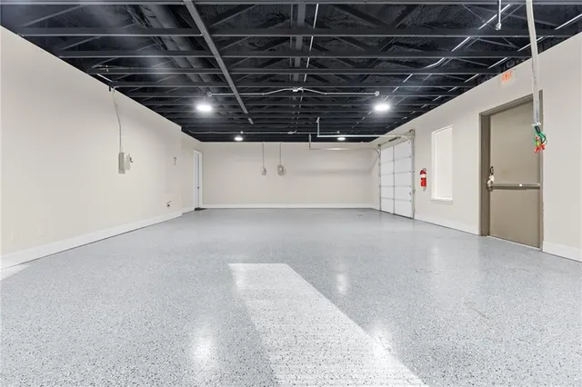 a front view of a building with a garden