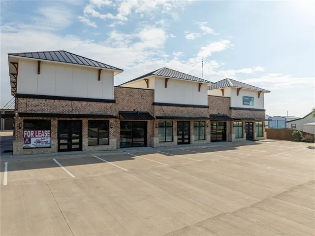 a swimming pool with outdoor seating and yard