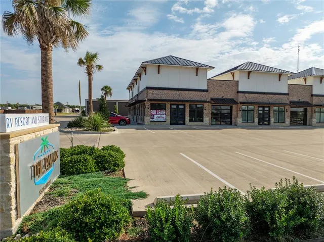 a front view of a house with large windows