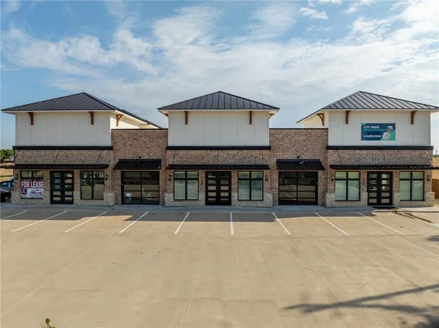 a view of a swimming pool with sitting area