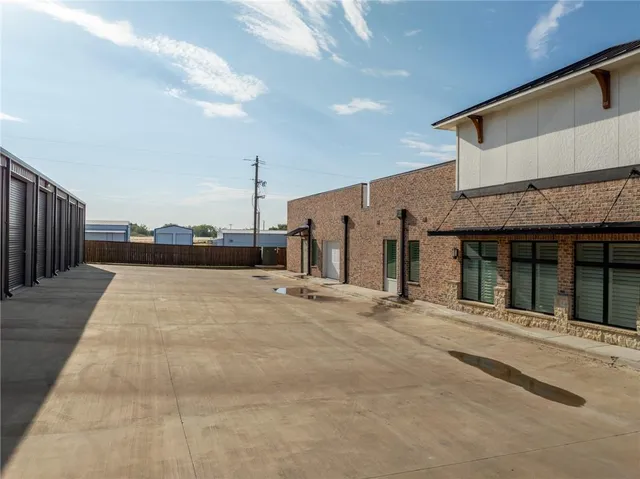 a front view of a house with parking space