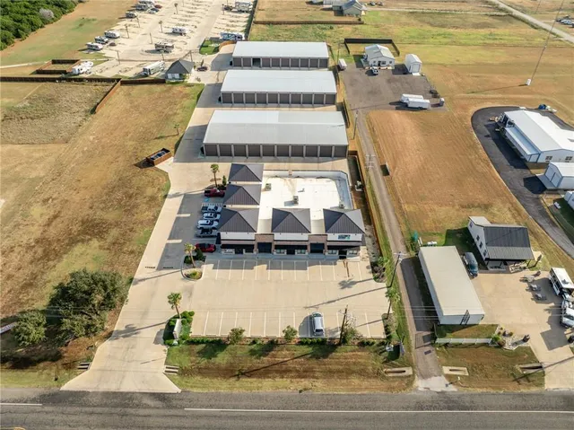 an aerial view of residential houses with outdoor space
