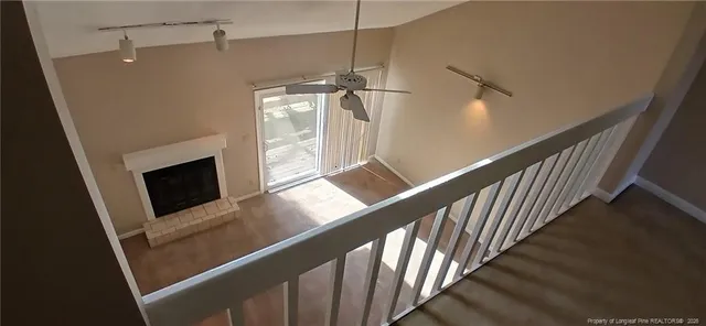 a view of a hallway with stairs