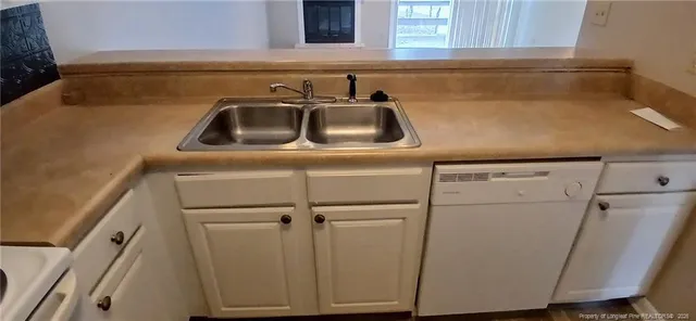 a bathroom with a sink and vanity