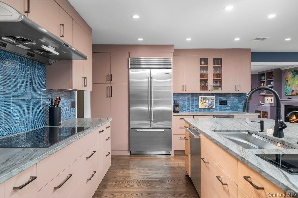 18 South Ridge Road Larchmont, NY 10538 - Photo 11 of 35 a kitchen with stainless steel appliances granite countertop a sink stove and refrigerator