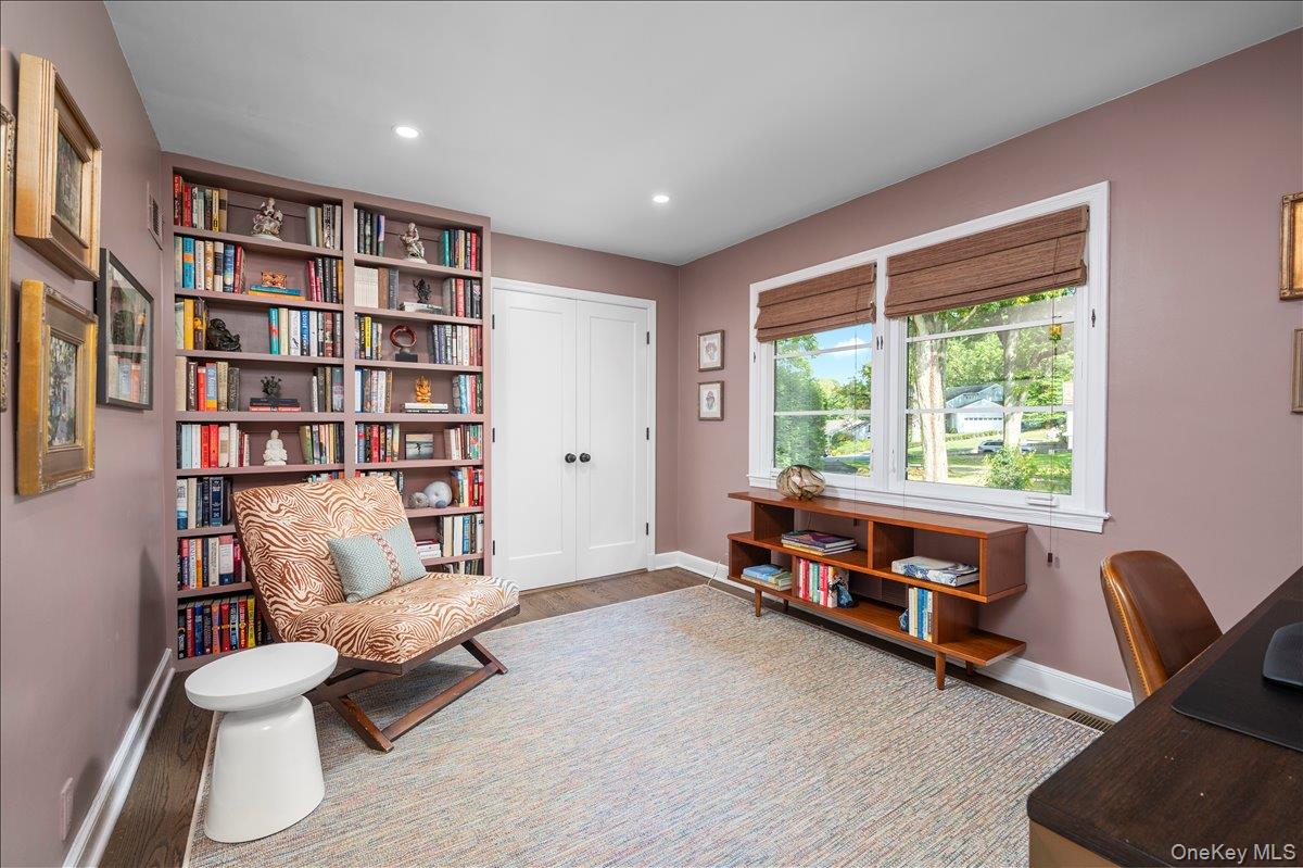 18 South Ridge Road Larchmont, NY 10538 - Photo 15 of 35 a living room with furniture and a book shelf