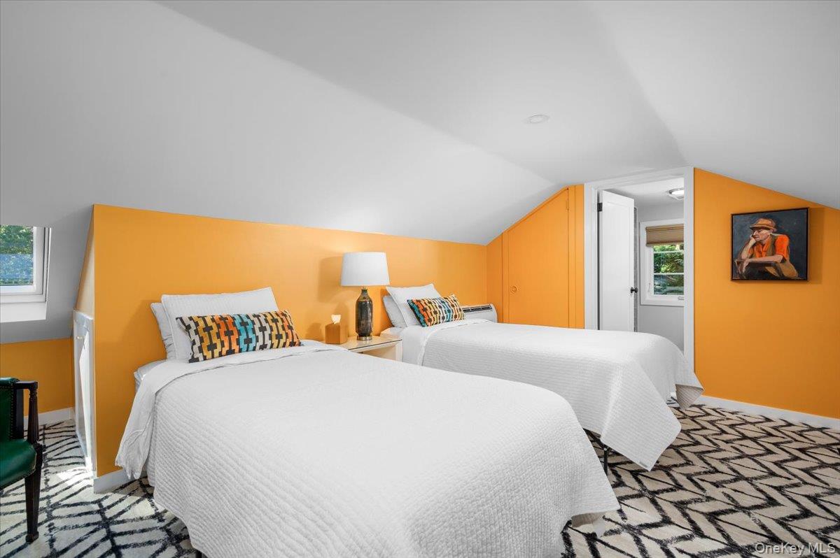 18 South Ridge Road Larchmont, NY 10538 - Photo 20 of 35 a bedroom with two beds and a large window