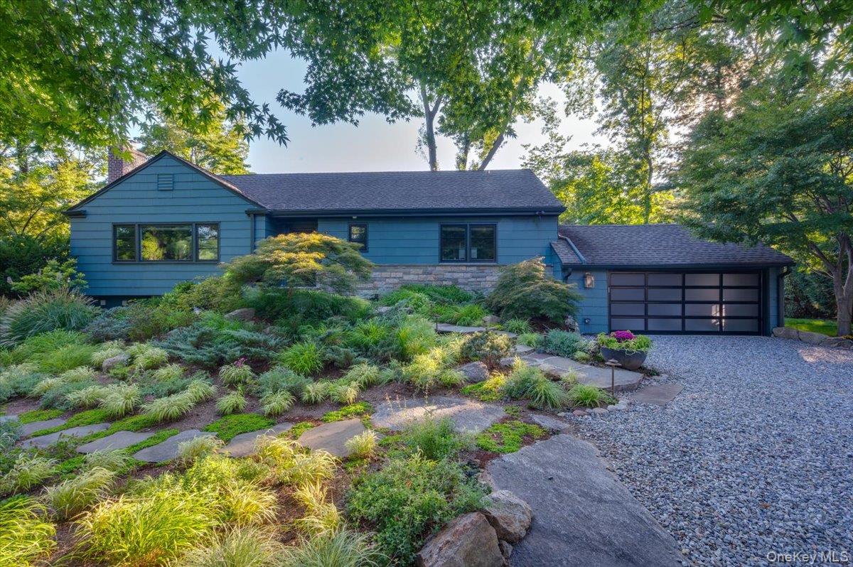 18 South Ridge Road Larchmont, NY 10538 - Photo 32 of 35 a front view of a house with garden