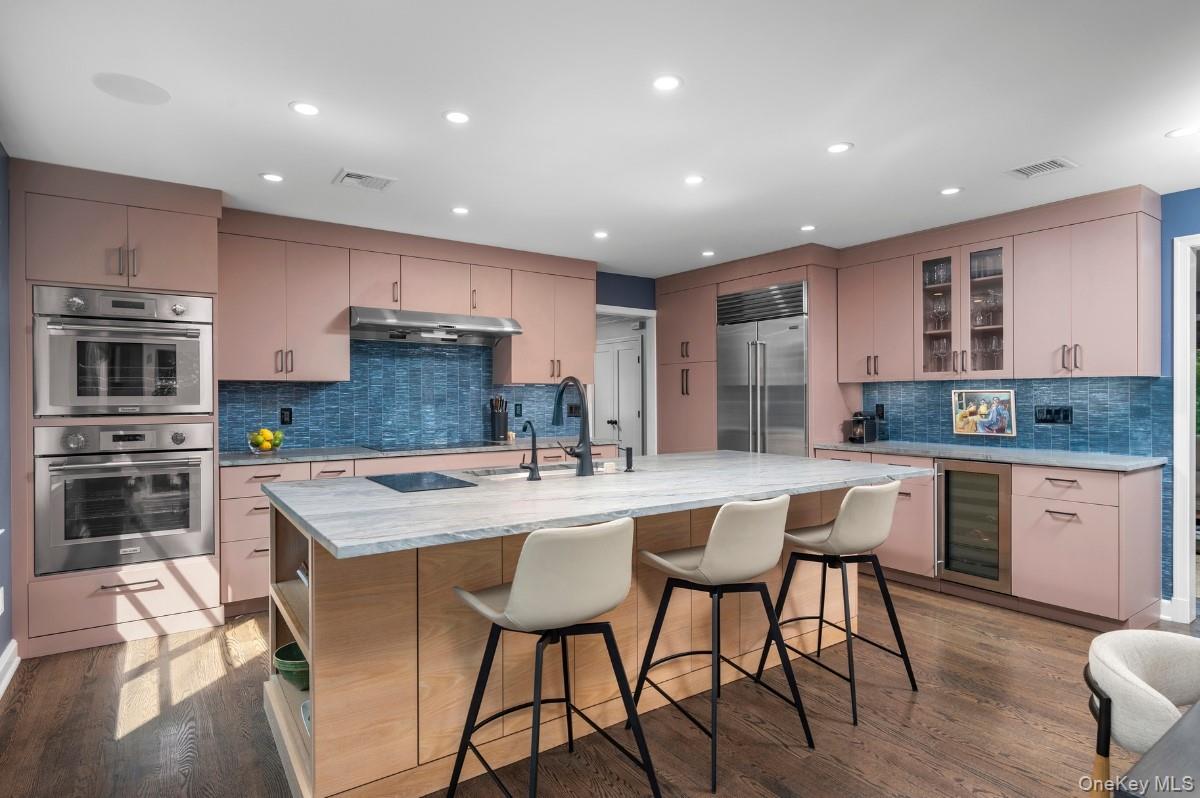18 South Ridge Road Larchmont, NY 10538 - Photo 8 of 35 a kitchen with counter space cabinets a sink and appliances