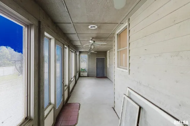 an aerial view of a swimming pool with outdoor seating