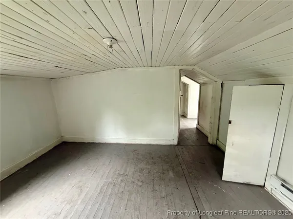 a view of an empty room and a window