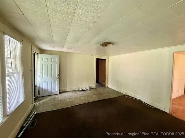 a view of an empty room and window