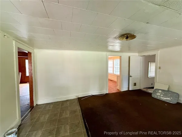 a view of an empty room and window