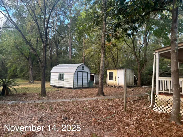 a view of a house and a yard