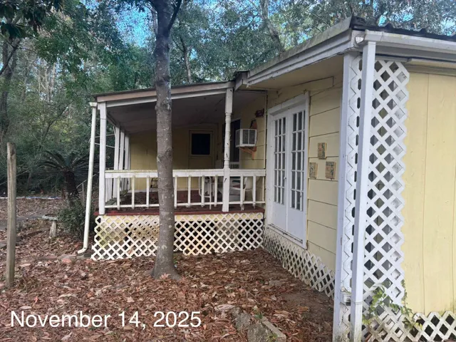 front view of a house with a large window