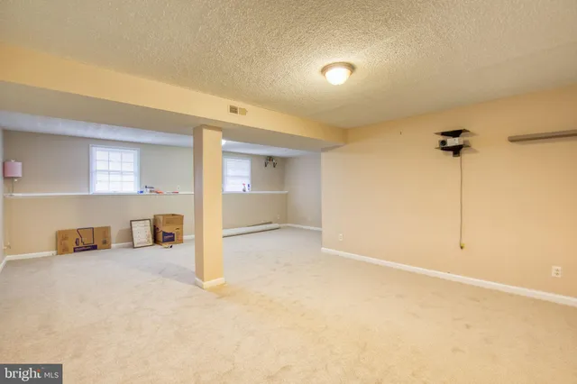 a view of a livingroom with a kitchen and a sink
