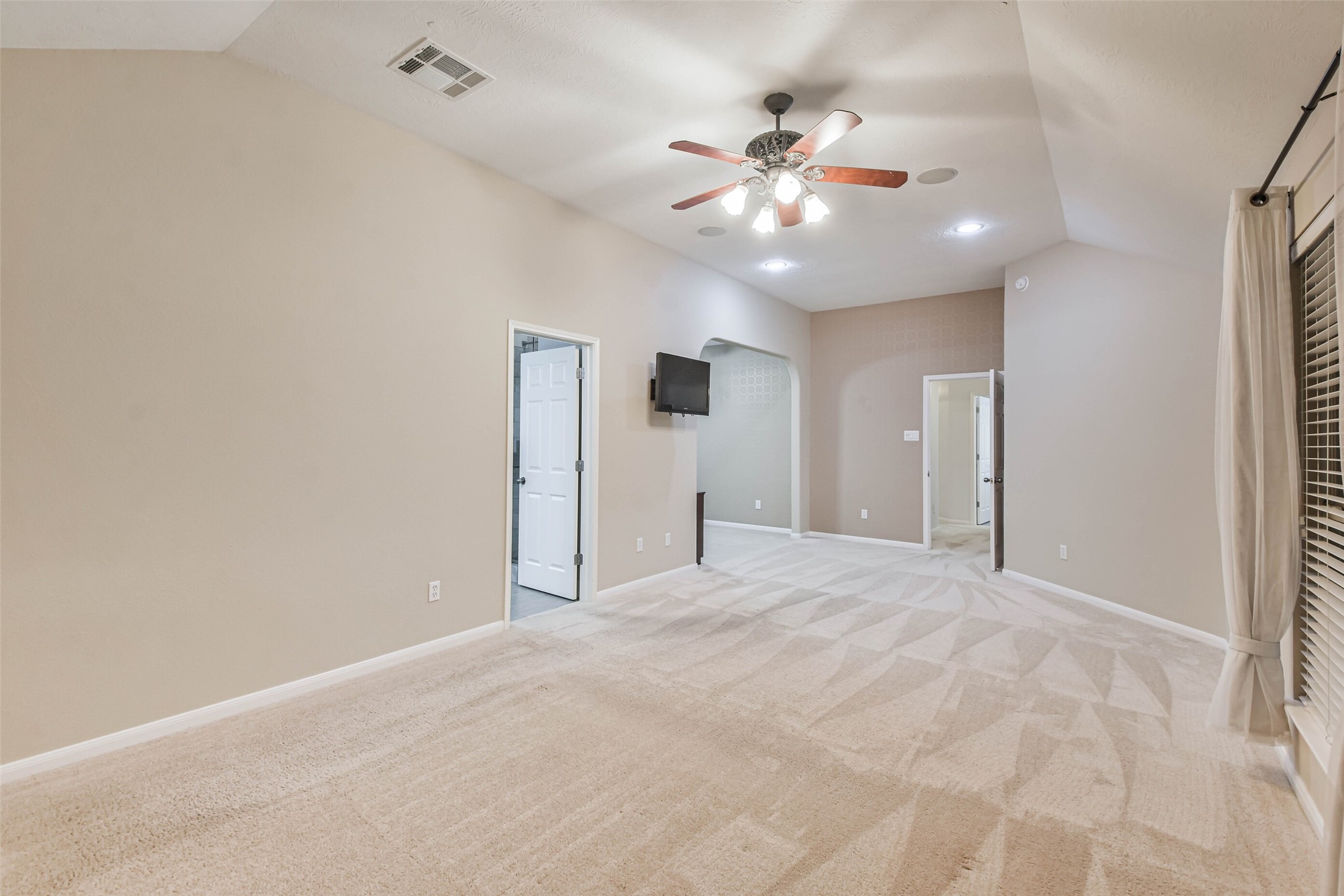 20942 Wind Field Lane Spring, TX 77379 - Photo 25 of 46 a view of an empty room with a chandelier fan