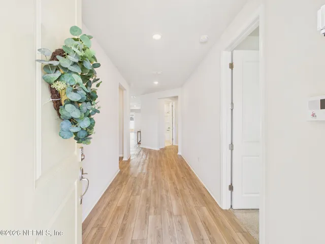 a bathroom with a bathtub and a window