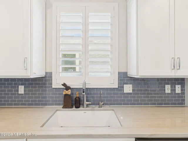 a kitchen with kitchen island granite countertop lots of counter top space and stainless steel appliances