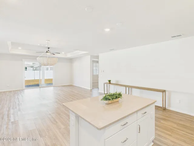 a kitchen with stainless steel appliances granite countertop a stove a refrigerator and a microwave