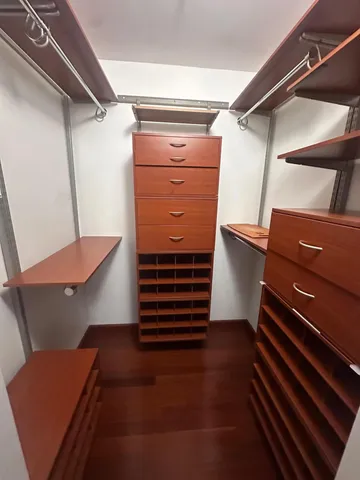 a view of a livingroom with furniture and a window