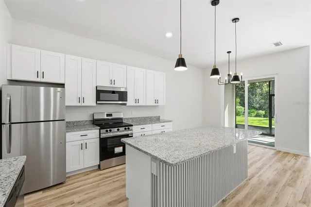 a kitchen with a sink and a window