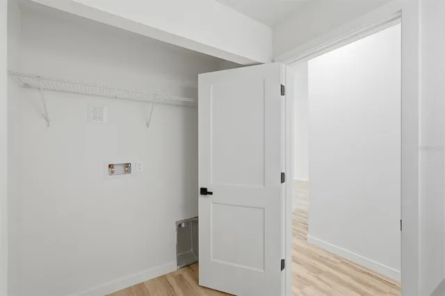 a bathroom with a granite countertop sink a mirror and shower