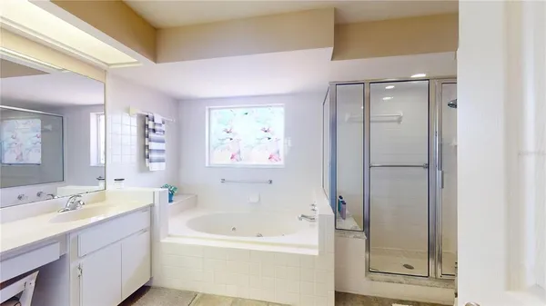 a bathroom with a shower and a glass door