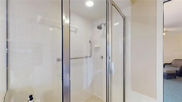 a bathroom with a tub a sink and a mirror
