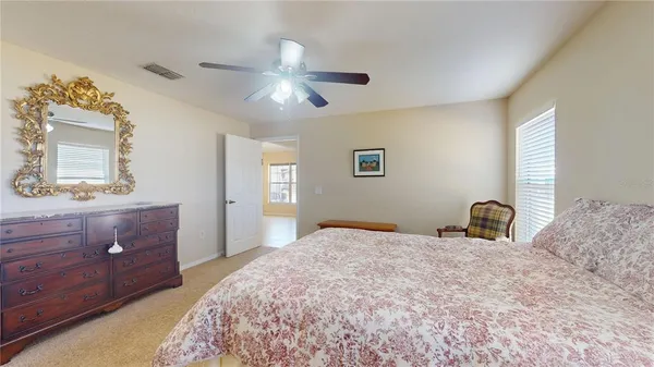 a view of wooden floor and windows in a room