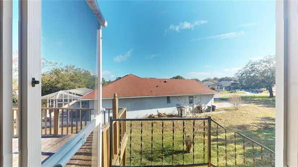 a view of balcony with wooden floor