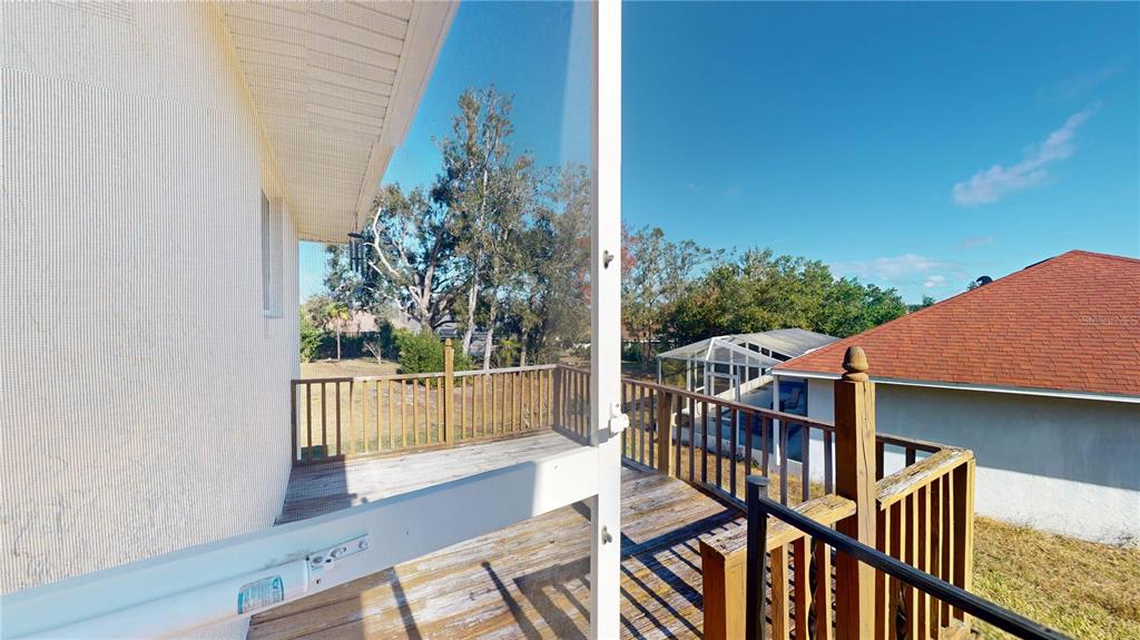 4427 North Bacall Loop Beverly Hills, FL 34465 - Photo 25 of 41 a view of balcony with wooden floor
